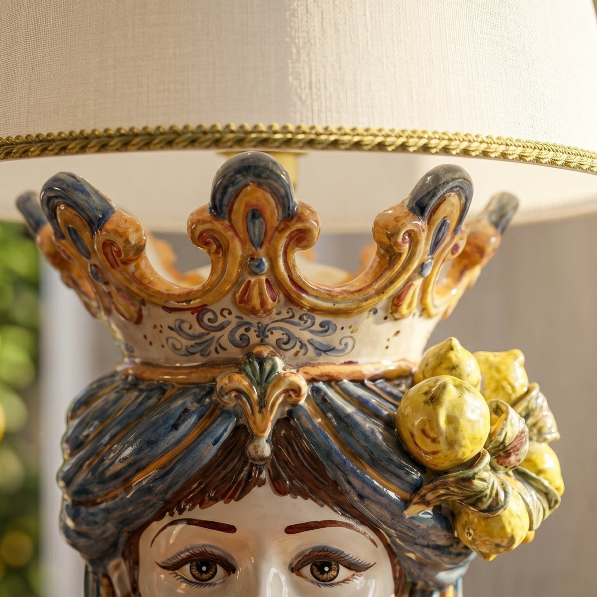 Head-shaped lamp with lemons, woman, blue and orange. Sicilian ceramics from Caltagirone, Sofia