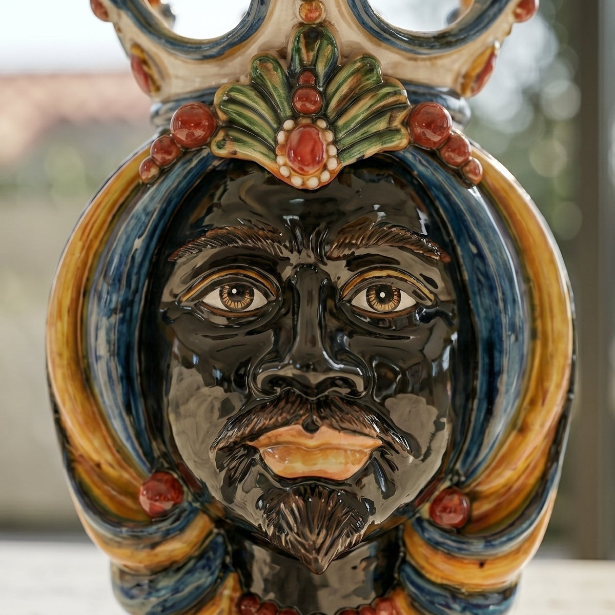 Head-shaped lamp, Moor male, blue and orange. Sicilian ceramics from Caltagirone, Sofia