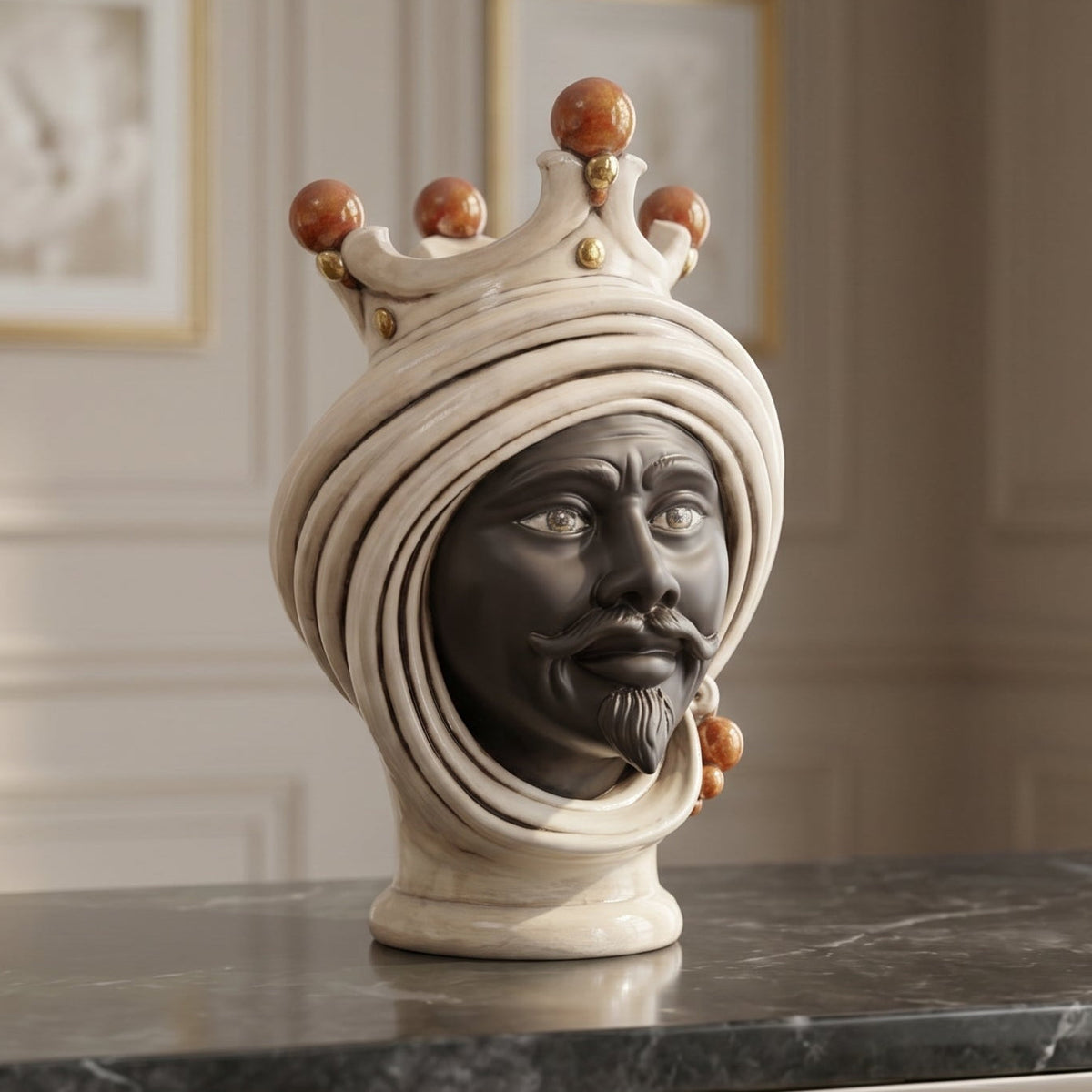 Male Testa di Moro with a matt dark bearded face, turban and crown, on black marble