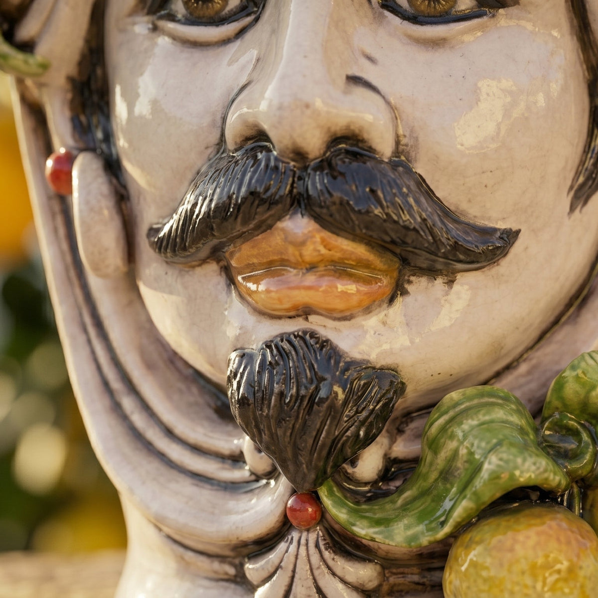 Testa di Moro with lemons, man, mother of pearl. Sicilian ceramics from Caltagirone, Sofia