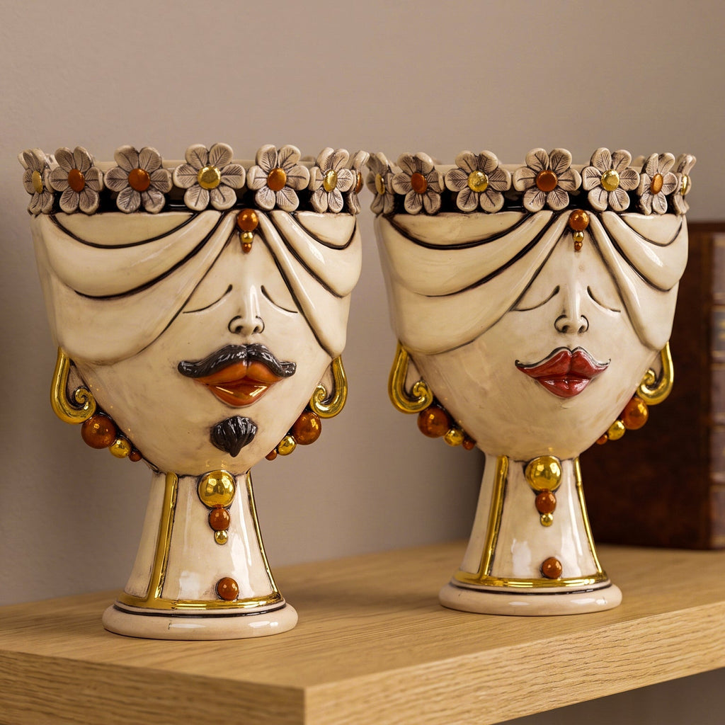 Pair of Zahira heads with flowers in antique mother of pearl with gold and lustres, man and woman, on a shelf