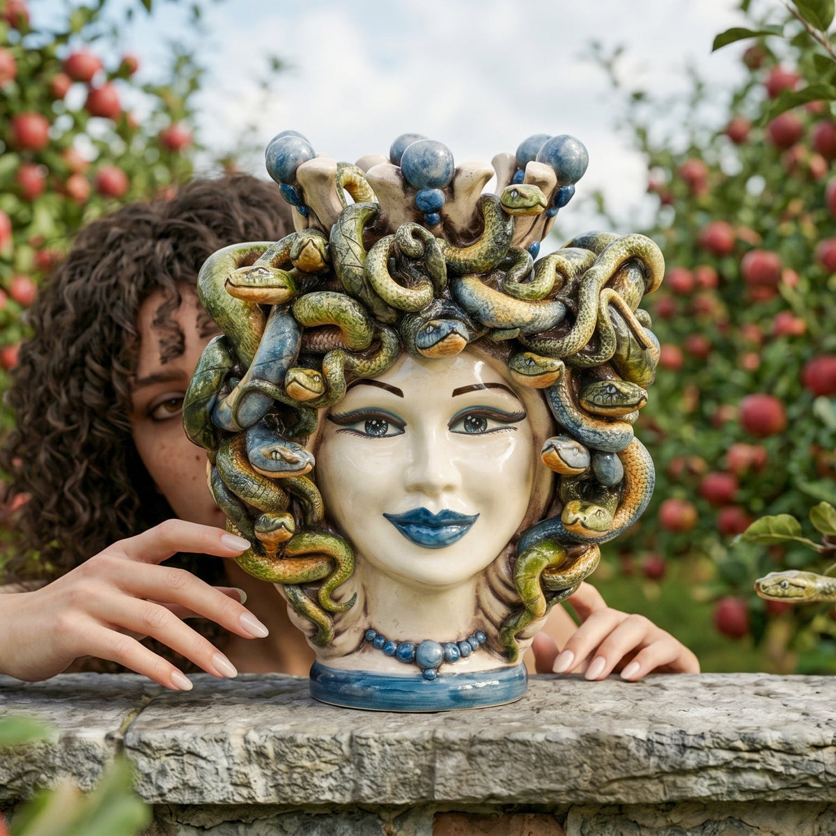 Medusa head with blue beads, hair of snakes. Sicilian ceramics from Caltagirone, Sofia