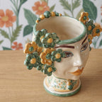Testa di Moro with flowers, green and orange. Sicilian ceramics from Caltagirone, Sofia