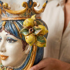 Detail of the hand-modelled Sicilian lemons on the blue and orange female Testa di Moro
