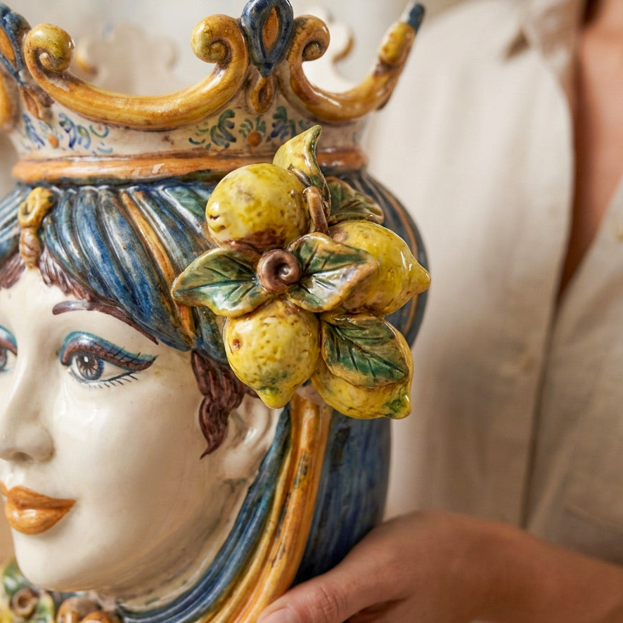 Detail of the hand-modelled Sicilian lemons on the blue and orange female Testa di Moro