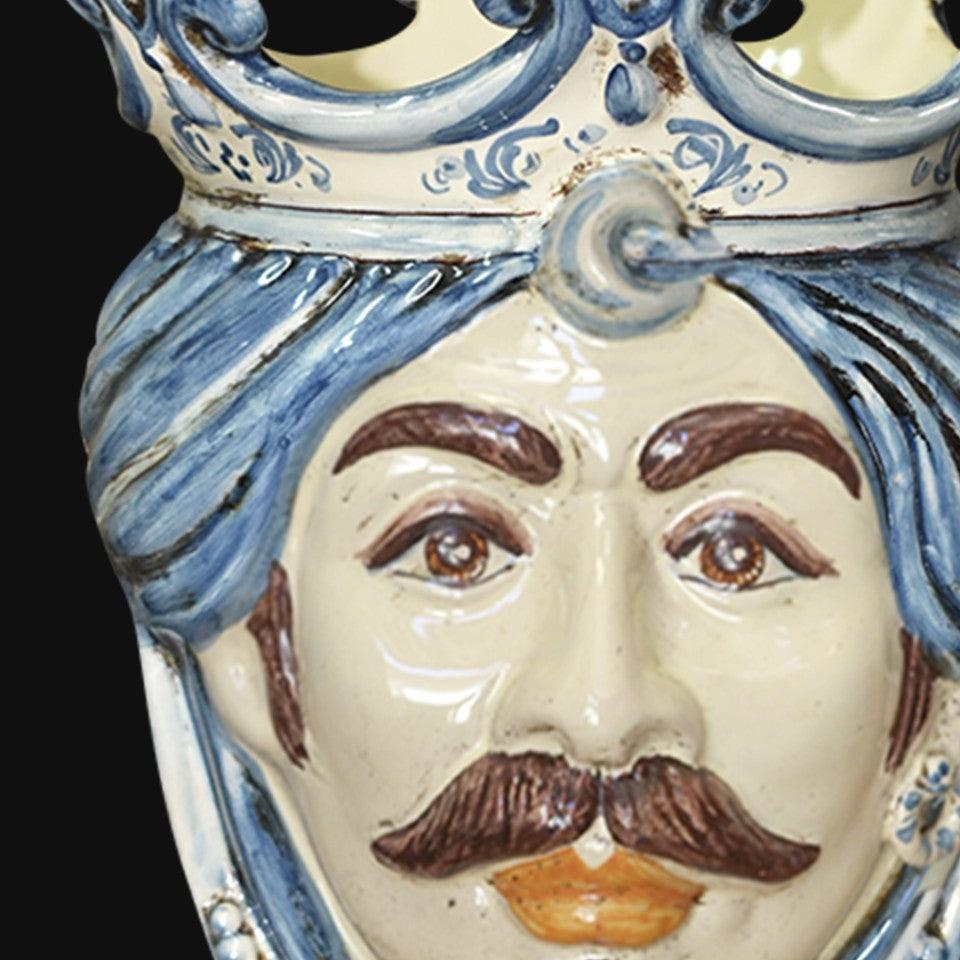 Handmade Caltagirone ceramics with bearded face and blue crown, traditional Sicilian art