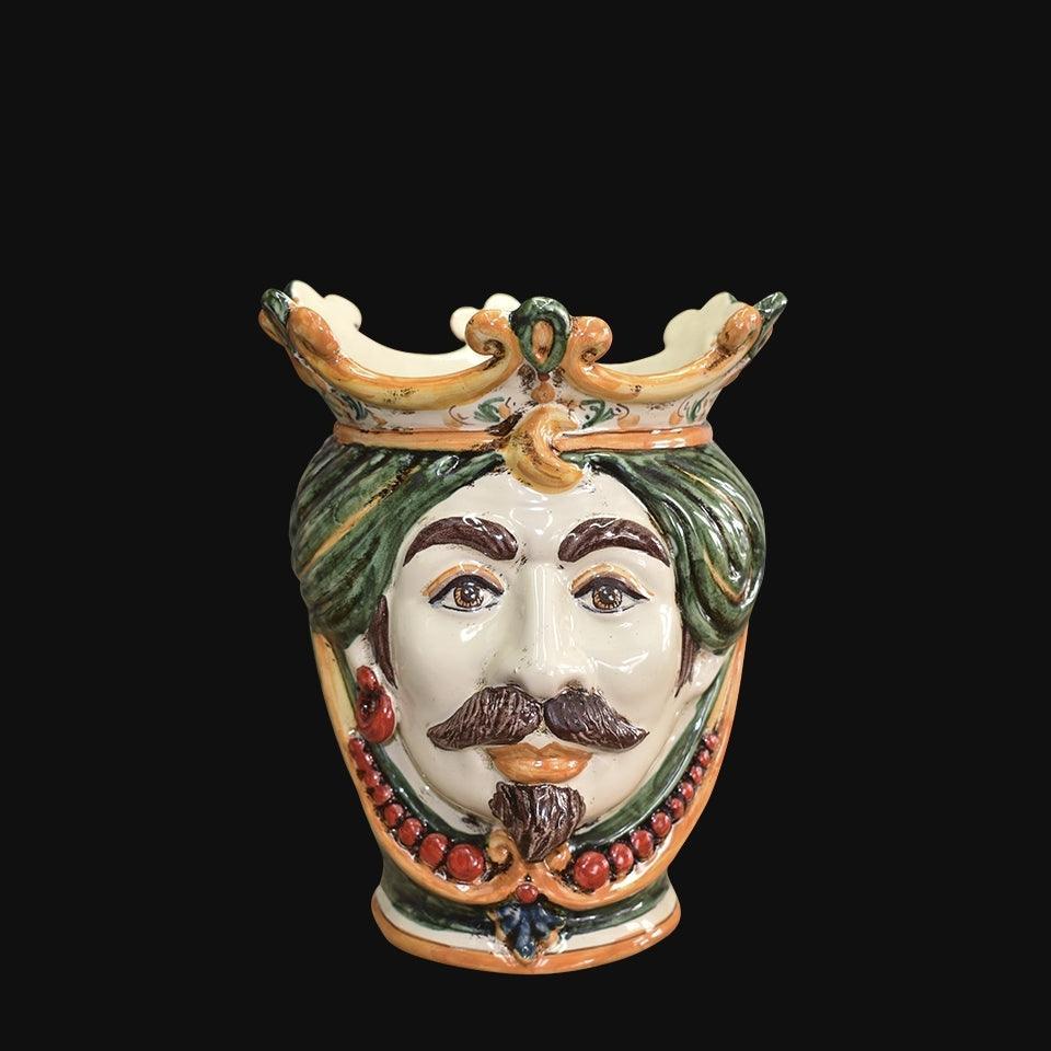 Handmade Caltagirone ceramics with regal face and crown, traditional Sicilian art