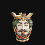 Handmade Caltagirone ceramics with regal face and crown, traditional Sicilian art
