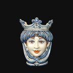 Handmade Caltagirone ceramics with a regal face and blue crown, traditional Sicilian art