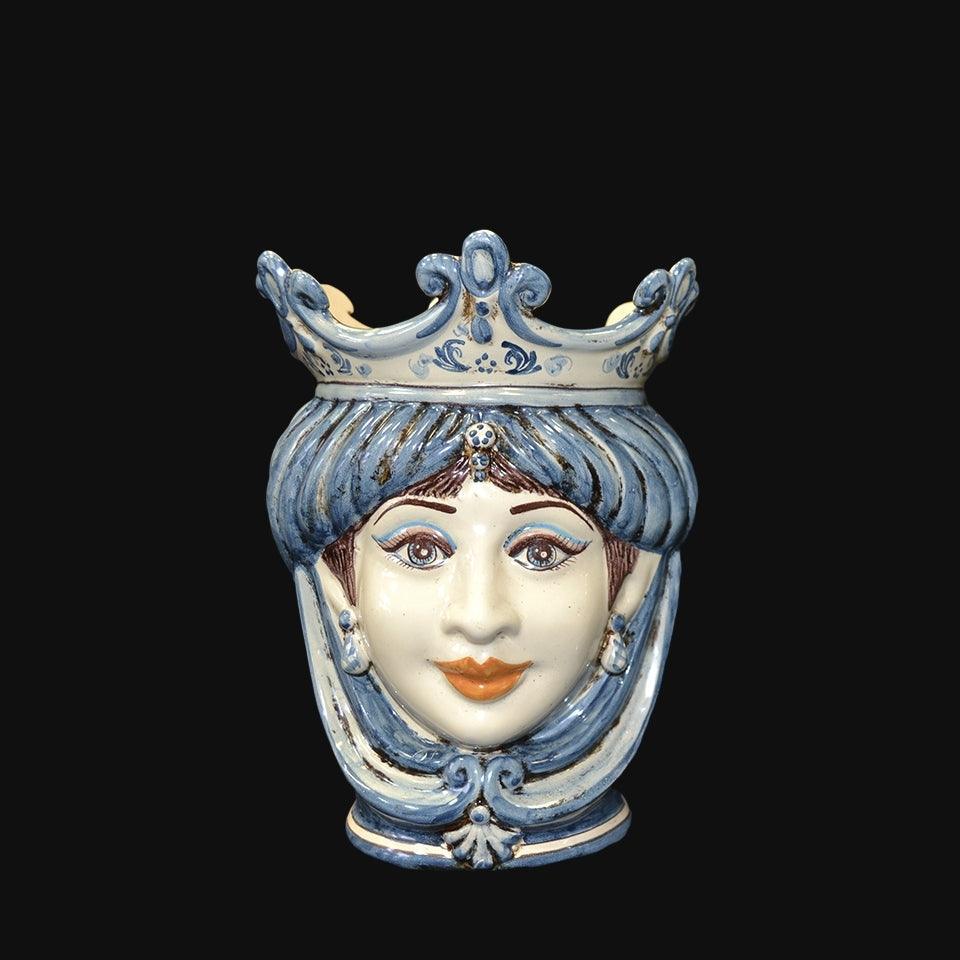 Handmade Caltagirone ceramics with a regal face and blue crown, traditional Sicilian art