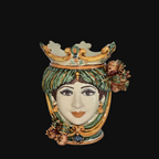 Handmade Caltagirone ceramics, woman's head vase with crown and floral details, sea in the background