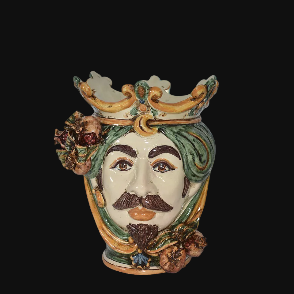 Handmade Caltagirone ceramic Testa di Moro decorated with crown, leaves and pomegranates, blue sea in the background