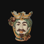 Handmade Caltagirone ceramic Testa di Moro decorated with crown, leaves and pomegranates, blue sea in the background
