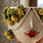 Close-up of the female Zahira head with hand-modelled lemons and green leaves