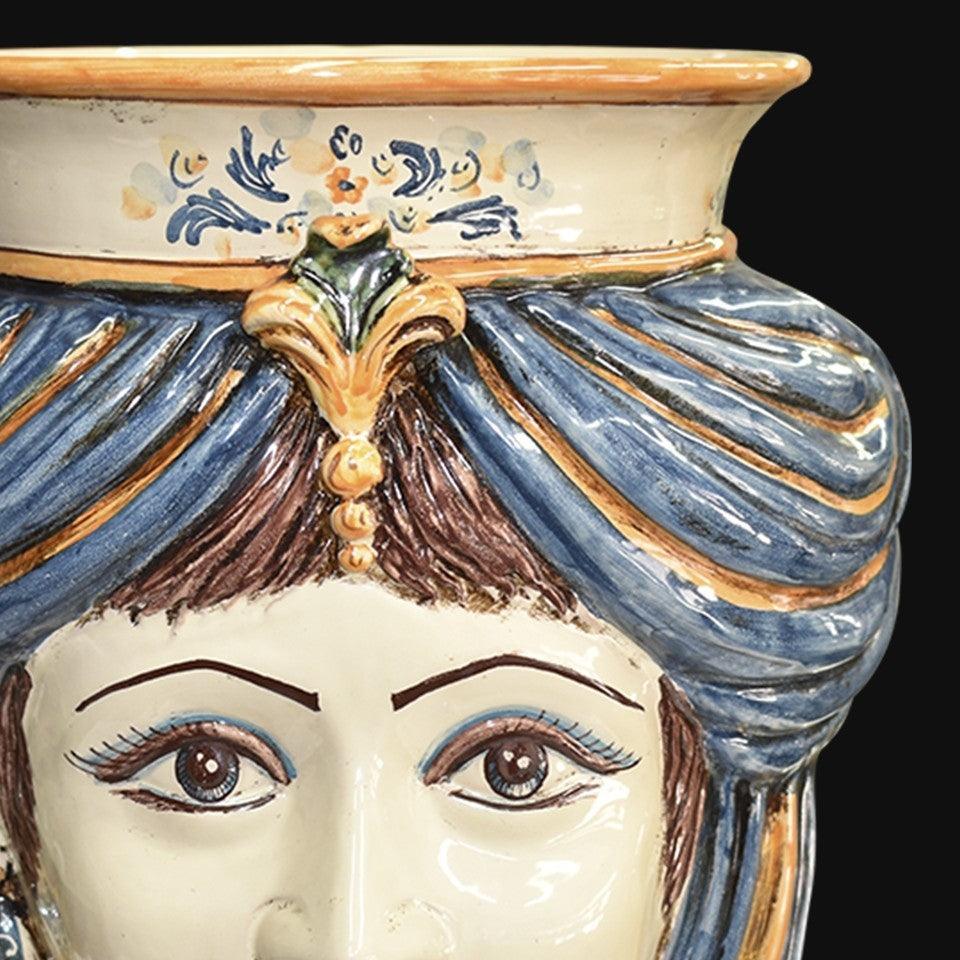 Handmade Caltagirone ceramics with a female face and blue and gold details