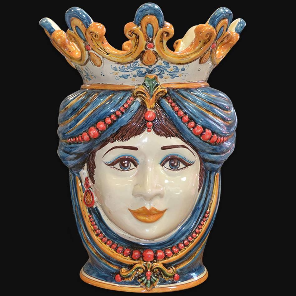 Handmade Caltagirone ceramics with female face and colourful crown, traditional Sicilian art