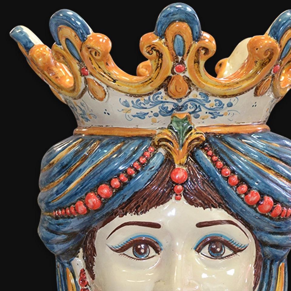 Handmade Caltagirone ceramics with blue and orange crown, red details and expressive eyes
