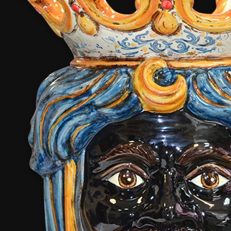 Handmade Caltagirone ceramics, statue with crown and colourful details, traditional Sicilian art