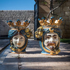 Woman and man Teste di Moro in handmade Caltagirone ceramics, blue and orange decoration with lemons, Sicilian craftsmanship.