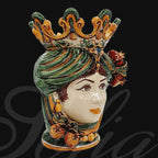 Handmade Caltagirone ceramics: female head with crown and colourful decorations, traditional Sicilian art