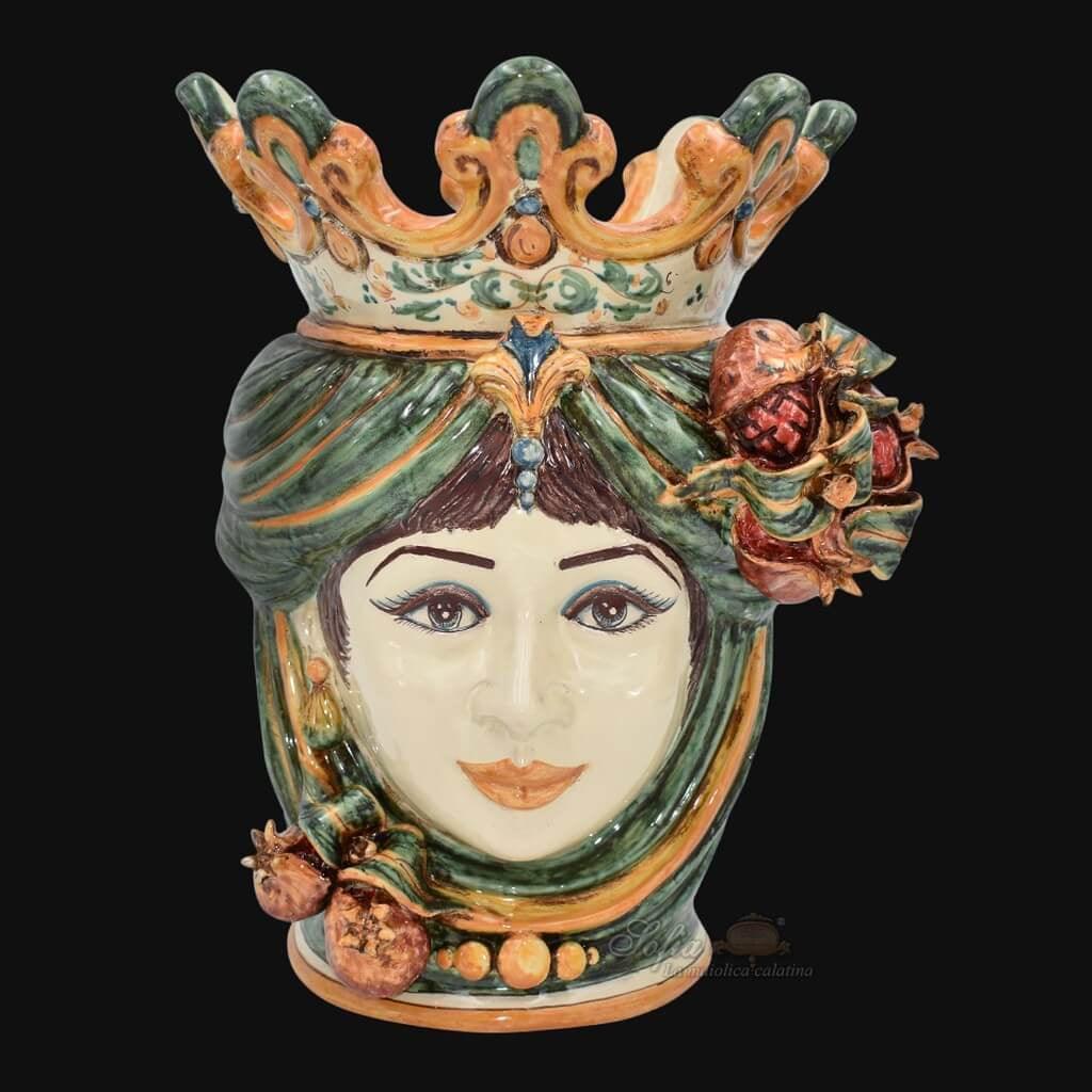 Handmade Caltagirone ceramics with a female face and crown, traditional Sicilian art