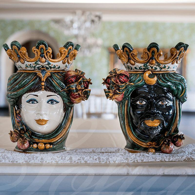 Handmade Caltagirone ceramics: regal faces with crowns and colourful details, traditional Sicilian art