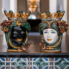 Handmade Caltagirone ceramics: decorative masks with crowns and colourful details, traditional Sicilian art